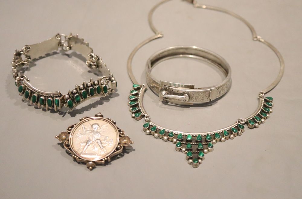 A Mexican 925 and malachite necklace and matching bracelet, a white metal bangle and coin set brooch.